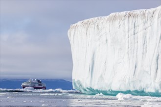 Cruise ship behind iceberg