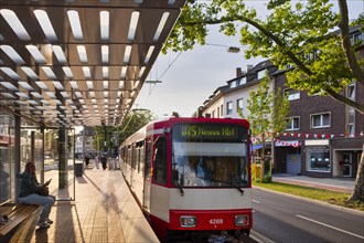 Tram of the Rheinbahn at the stop Nikolaus-Kopp-Platz in the district Heerdt
