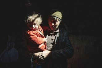 Man with child in his arms