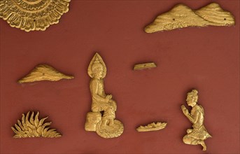 Gilded wall decorations with depictions from the Jakata narratives about the former lives of the Gautama Buddha