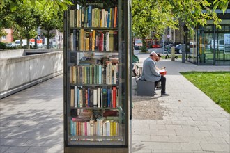 Public bookcase on the sidewalk of the Luegallee in the district Oberkassel