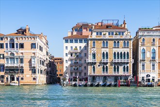 Historic house facades and parked gondolas in the Canale Grande