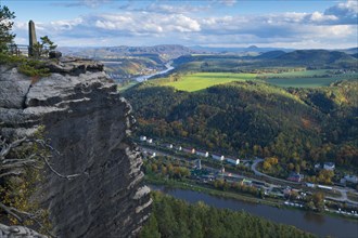 View from the autumnal Lilienstein on the Elbe river near Koenigstein to Bad Schandau and over the German-Czech border with Mount Ruzova