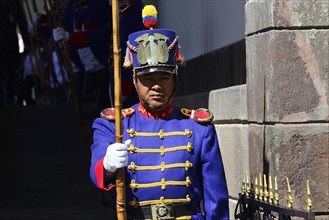 Guard in colourful uniform in front of the seat of government Palacio de Carondelet
