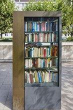 Public bookcase on the sidewalk of the Luegallee in the district Oberkassel