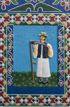 Portrait of a farmer on a grave cross in the Merry Cemetery