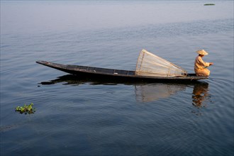 Traditional fisherman on his small boat
