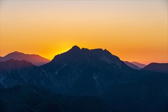 Sunset behind mountain silhouette