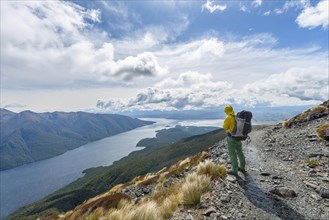 Hiker looks out over the South Fiord of Lake Te Anau