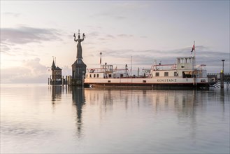 Sunrise with the old ferry Konstanz with Imperia in the harbour of Konstanz