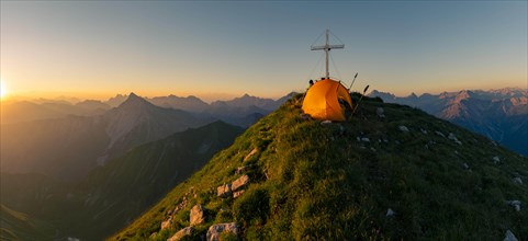 Cross of the Kreuzspitze with tent at the summit