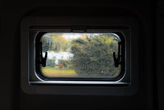 View out of a blessed window of Campervan