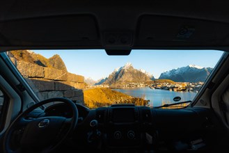 View from the windscreen of the campervan on Reine with the Bringing in Fjord at sunrise