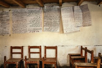 Teaching material on a wall and chairs