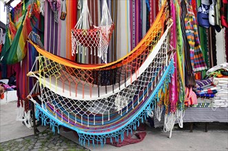 Colourful textiles and hammocks at the handicraft market