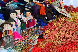 Dolls made of fabric and necklaces at the handicraft market