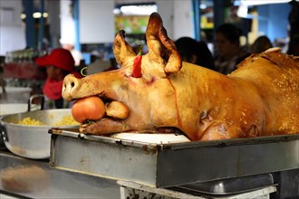 Whole sucking pig at a market stall