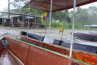 Boats at the Rio Napo in heavy rain
