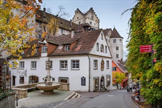 Old town alley with fountain and the castle Meersburg