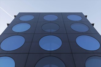 Facade with blue portholes