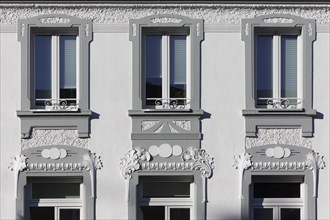 Art Nouveau stucco facade with windows