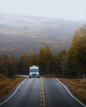 Campervan drives on the road to Kautokeino in autumn