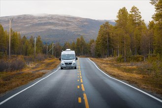 Campervan drives on the road to Kautokeino in autumn