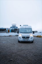 Campervan parked in front of the North Cape building