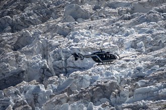 Helicopter over glacier