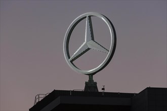 Illuminated Mercedes star on Mercedes Benz building in Stuttgart-Untertuerkheim