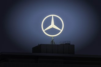 Illuminated Mercedes star on Mercedes Benz building in Stuttgart-Untertuerkheim