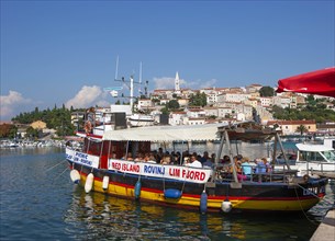 Excursion boat with tourists in the port