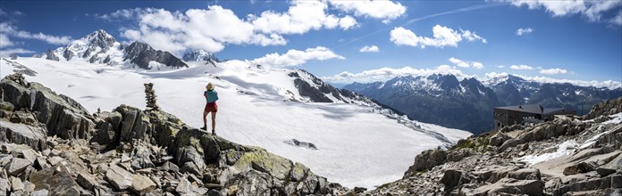 Hiker standing in front of glacier