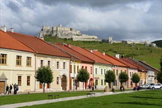 Row of houses and Spiss Castle Spissky Hrad