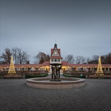 The station building of Bad Saarow with the fountain 'Lebensfreude' by the sculptor Hans Eickworth