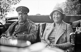 Paul von Hindenburg and a woman sitting in a carriage