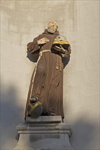 Monk figure with book and skull at the seminary in Hildesheim