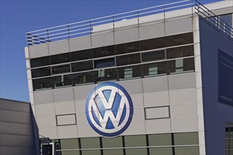 VW logo on a car dealership