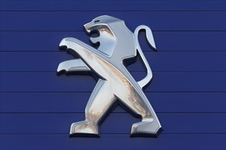 Lion from the Peugeot logo on a car dealership