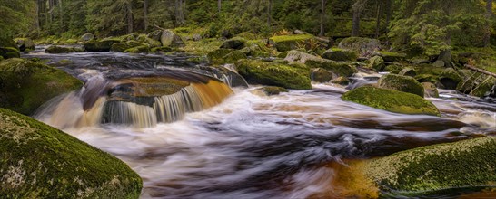 Waterfall at the Vydra with huge boulders in the riverbed