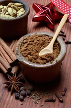 Gingerbread spice in clay pots and ingredients