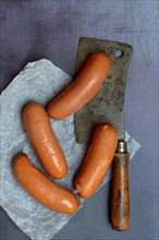 Meat sausages with cleaver