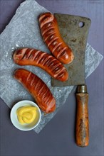 Meat sausages and skin with mustard