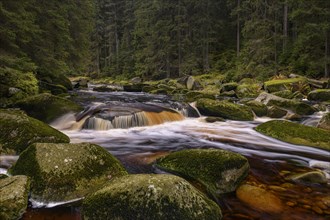 Waterfall at the Vydra with huge boulders in the riverbed