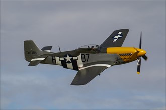North American Aviation P-51 Mustang aircraft in flight in United States Airforce markings