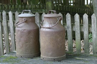Rusty old iron milk cans