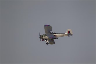Fairey Swordfish aircraft in flight in Royal Navy markings