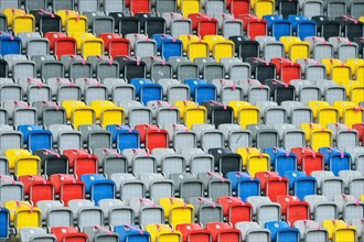 Colourful seating shells in the empty Merkur-Spiel-Arena