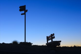 Bench and signpost