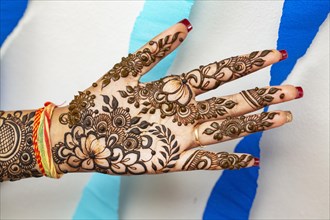 Henna tatoo on bride's hand on her the eve of her wedding date in Beau Bassin